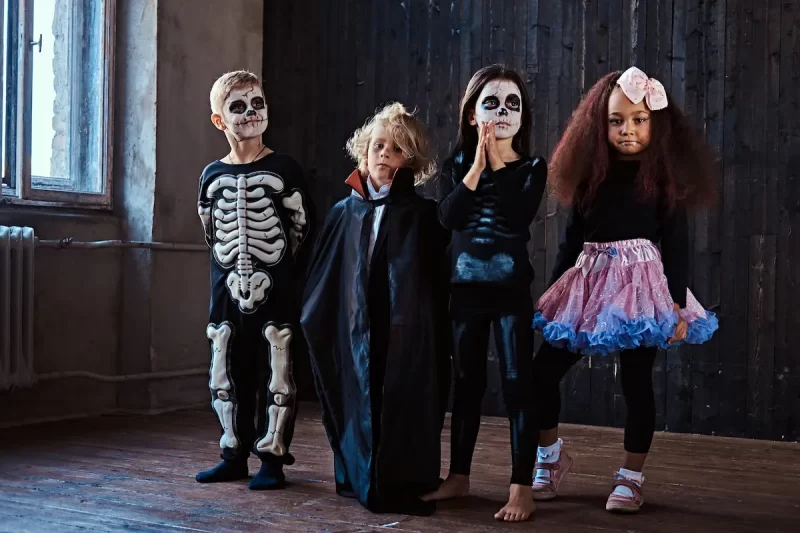 halloween-party-with-group-children-who-sitting-to-2025-01-25-16-05-05-utc
